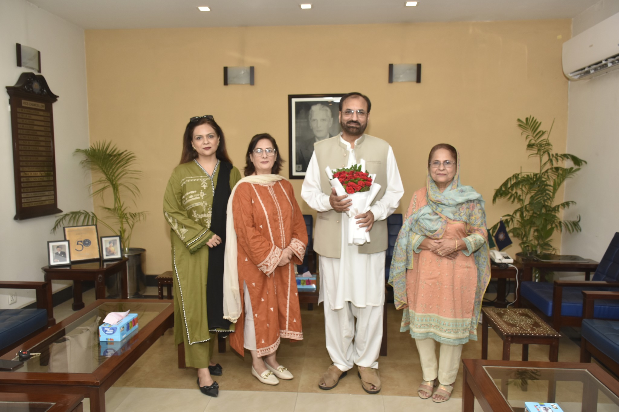 Prof. Dr. Neelum Naz, Prof. Dr. Rifaat Dar, and Ms. Manila Afzal Present Bouquet to Prof. Dr. Shahid Munir, Congratulating Him on His New Role as Vice Chancellor UET Lahore