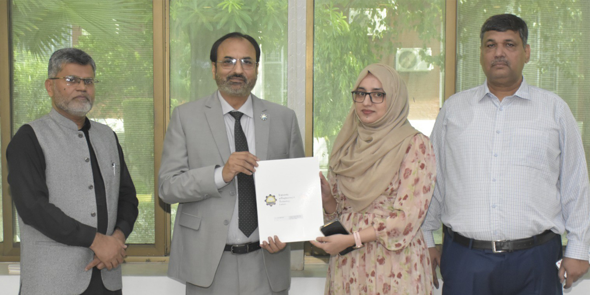 Vice Chancellor UET, Prof. Dr. Shahid Munir (TI), presenting promotion letters to faculty members.
